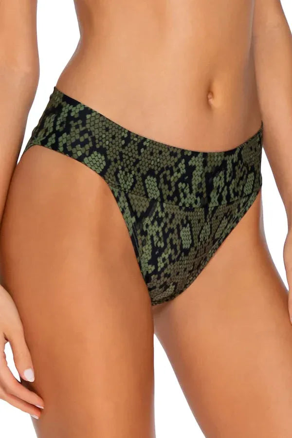 Green patterned bikini bottom worn by a person on a white background